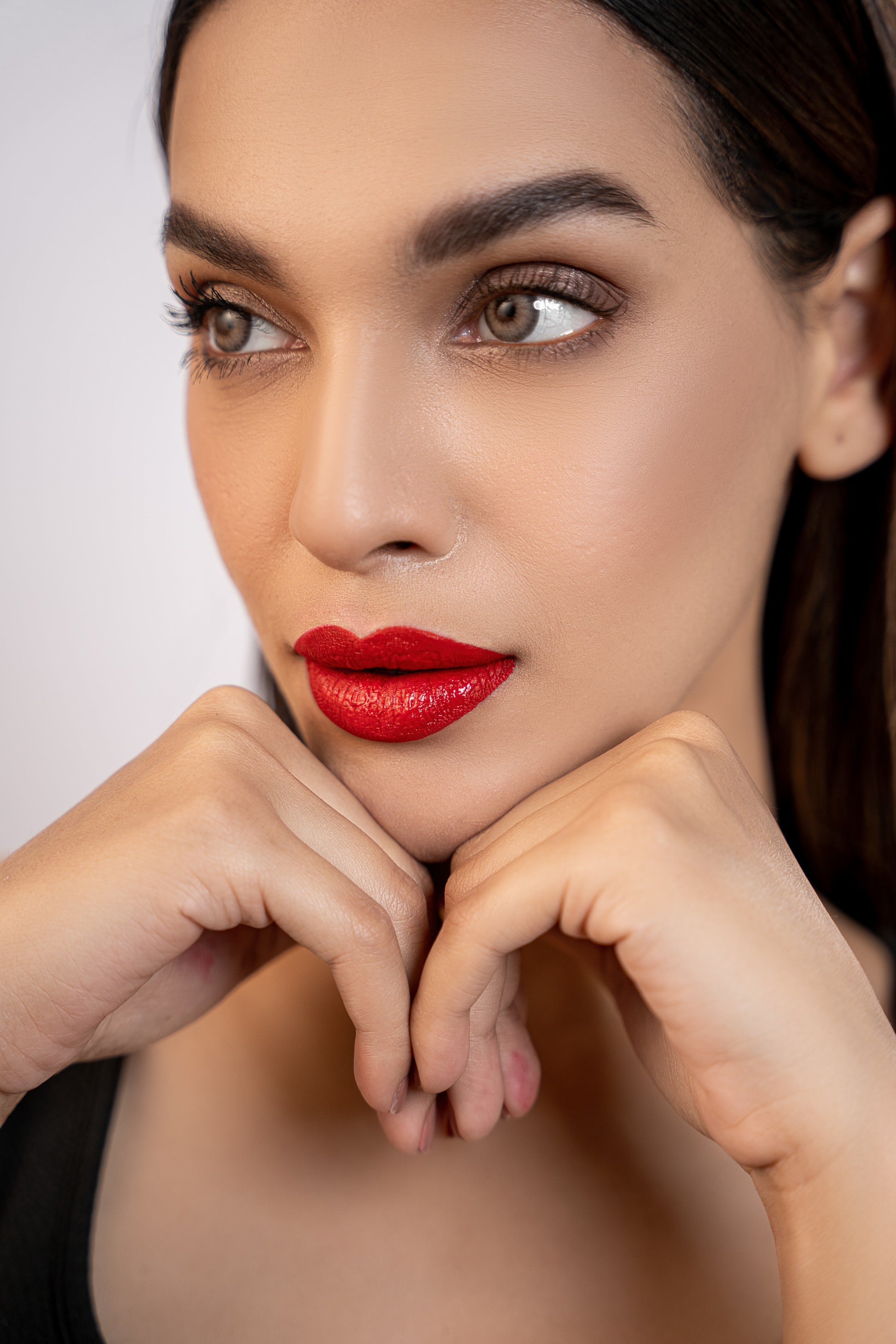 close up of blush me shiny red lip gloss by zahra naveed