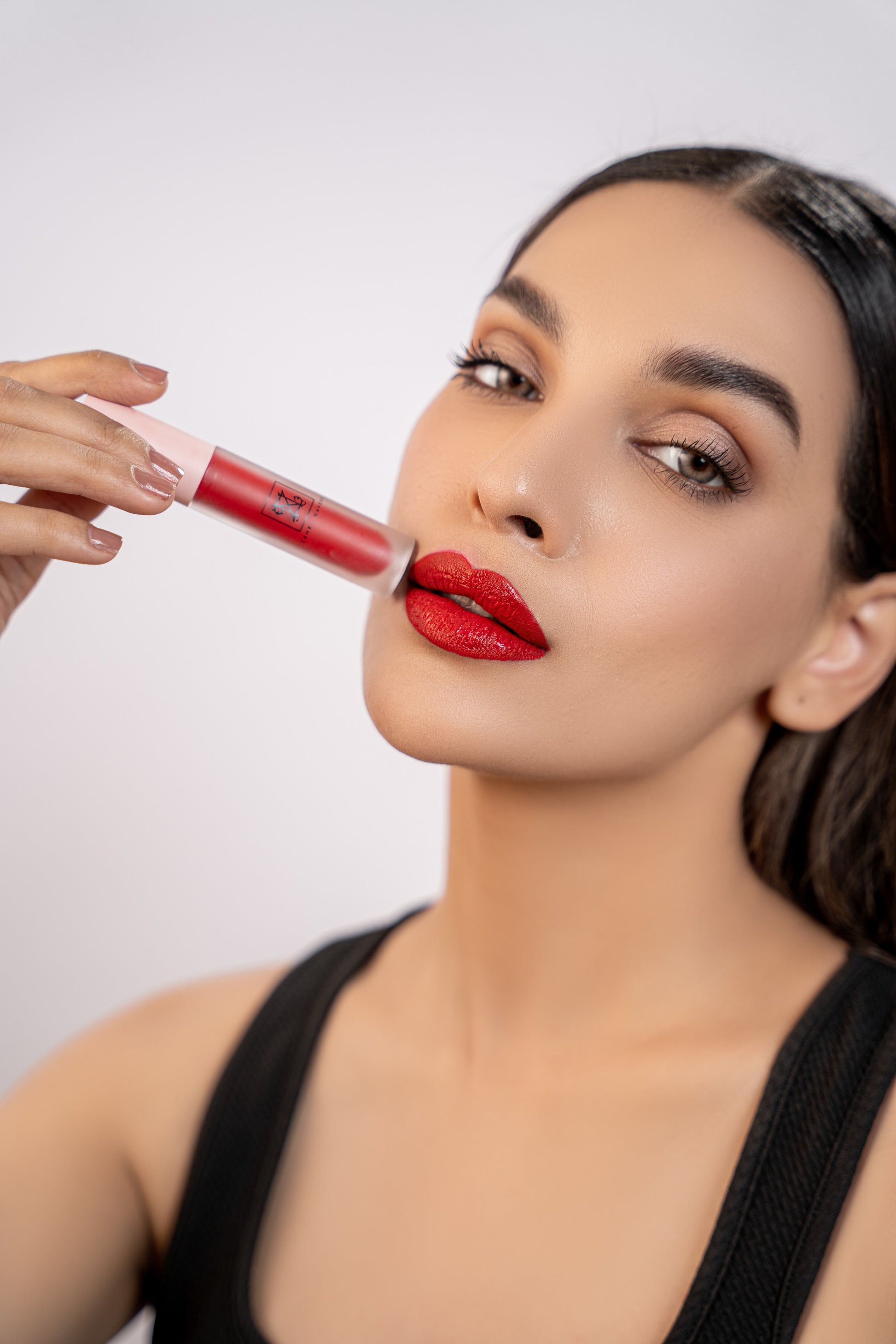 zahra naveed shiny red lip gloss blush me on a model